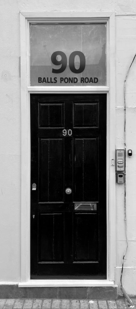 black wooden door with silver handle