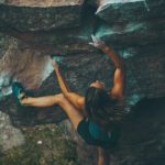 woman climbing mountain