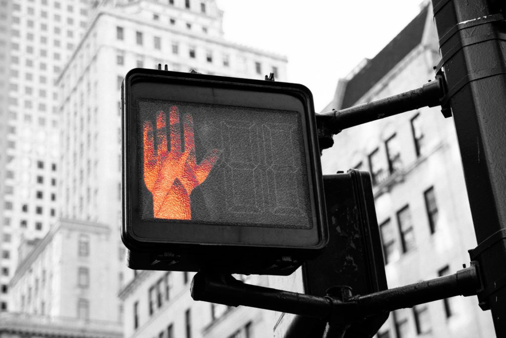 close up photo of street go and stop signage displaying stop